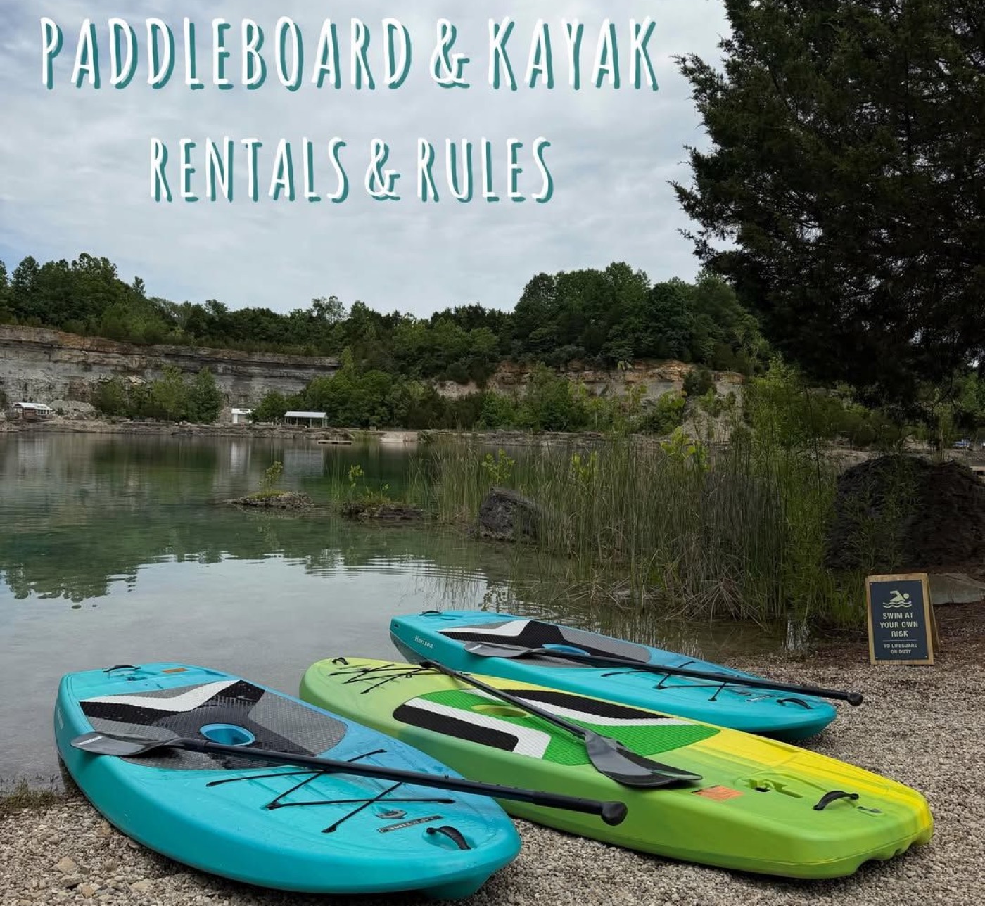 Paddleboards and kayaks lined up at the rental shop